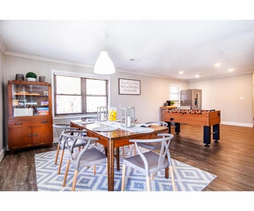 a dining room with a table and chairs at Classic Lake House Lakefront with Fire Pit and Dock in Louisville