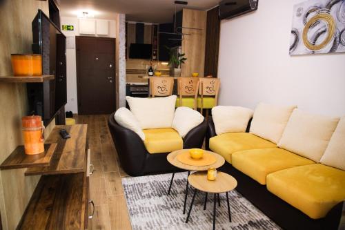 a living room with a couch and a table at Avenija in Kragujevac