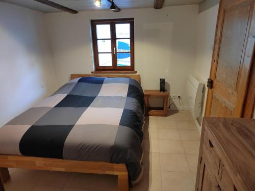 Ένα ή περισσότερα κρεβάτια σε δωμάτιο στο Petite maison alsacienne