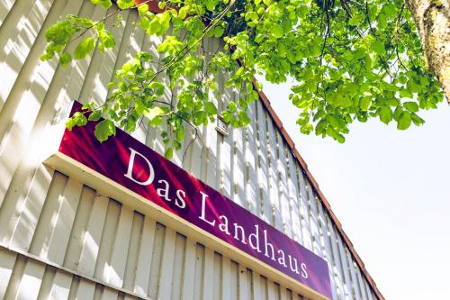 a sign on the side of a building at Regenbogen Boltenhagen in Boltenhagen