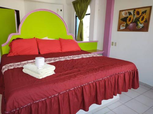 Hotel Real del Quijote a sólo 50 metros de la playaにあるベッド