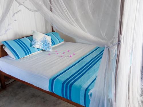 Ένα ή περισσότερα κρεβάτια σε δωμάτιο στο Bluebell Guest House
