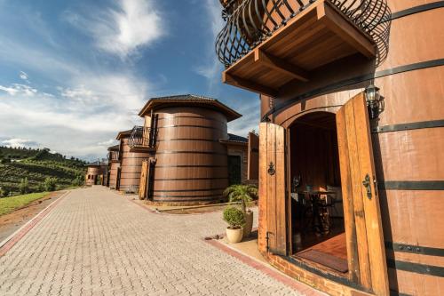 a row of silos on the side of a building at Pipas Terroir & Domos Perlage - Experiências Únicas no Vale dos Vinhedos in Bento Gonçalves