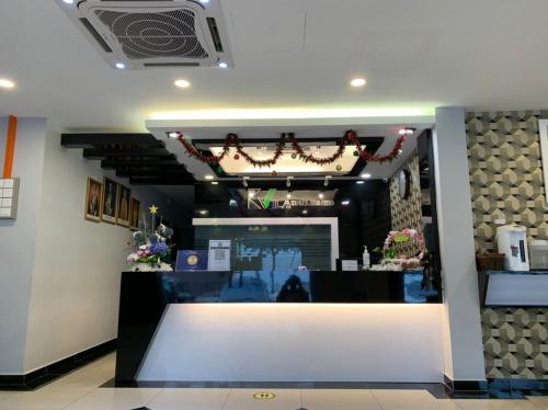 a store with a white counter in a room at K VILA HOTEL in Sungai Petani