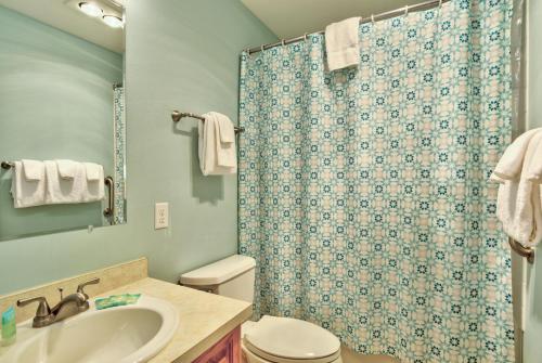 a bathroom with a toilet sink and a shower at Sea Gypsy Rentals in Lincoln City