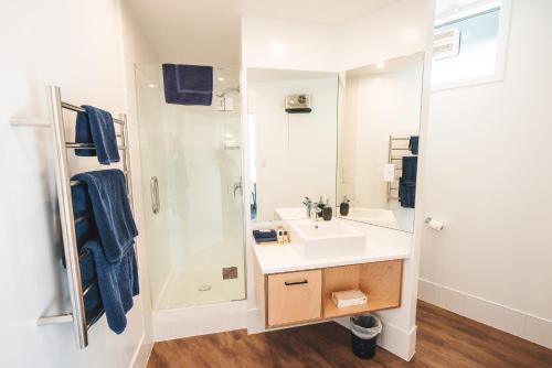 a bathroom with a sink and a shower at Blue Peaks Lodge in Queenstown