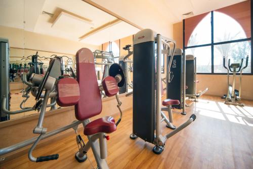 a gym with several treadmills and exercise bikes at Pickalbatros Aqua Fun Club All Inclusive in Marrakech