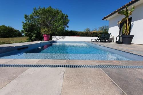 a swimming pool in the backyard of a house at Studio Provence in Istres