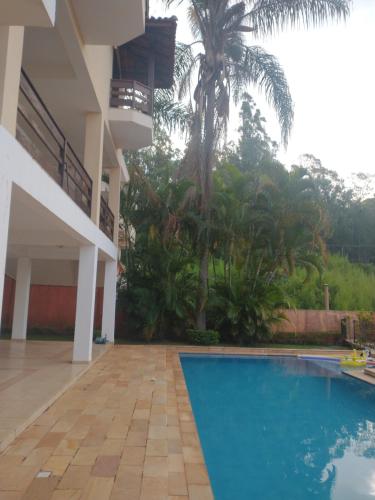 a view of a house with a swimming pool at Casarão Primavera in Serra Negra