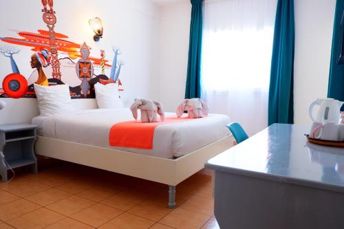 Postel nebo postele na pokoji v ubytování Hôtel Du Cirque