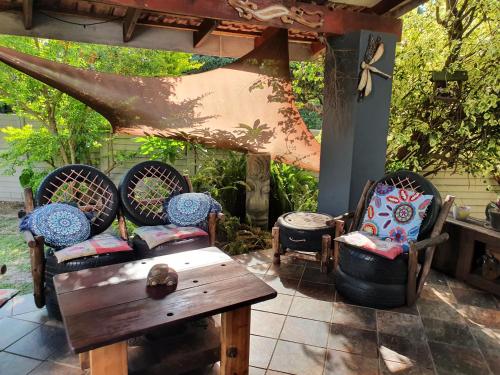 a patio with two chairs and a table and a table sidx sidx at Hacienda Holiday Home in Richards Bay