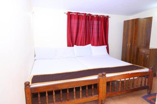 Postel nebo postele na pokoji v ubytování kollanoor guest house