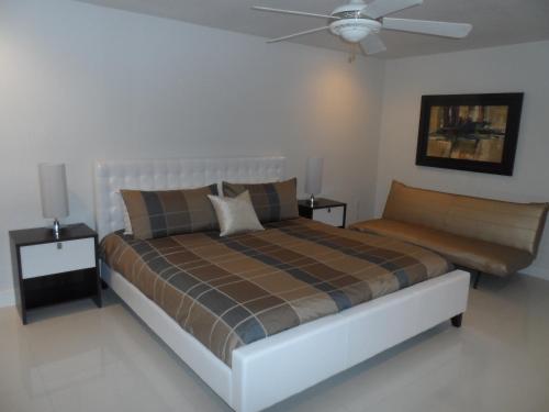a bedroom with a bed and a ceiling fan at Villas at Bahia Mar in South Padre Island