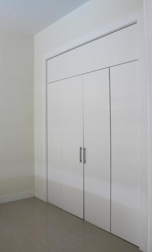 a white closet with two doors in a room at Villas at Bahia Mar in South Padre Island