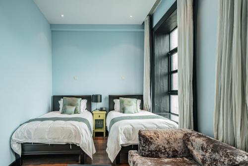 Postel nebo postele na pokoji v ubytování Gracie Art Hotel