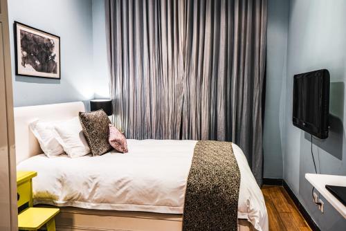 Ένα ή περισσότερα κρεβάτια σε δωμάτιο στο Gracie Art Hotel