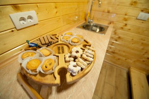 a tray of food on a table in a kitchen at Brvnare MADERA Banja Ždrelo in Ždrelo