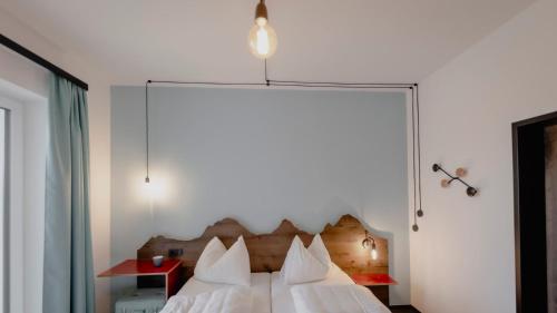 Voodi või voodid majutusasutuse Bett & Berg Bad Ischl, Self Check-In toas