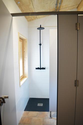 a room with a hallway with a door and a window at Santa Brigida - Real 1 in Hontanas