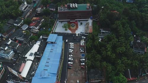 an overhead view of a parking lot in a city at Magnet Hotel in Kannur