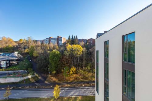 an apartment building with a view of a street at Radisson Blu Hotel Oslo Alna in Oslo