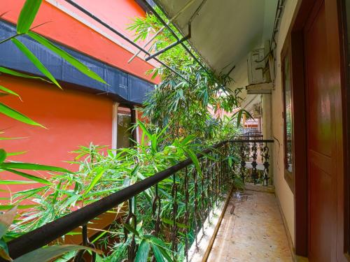 a balcony with plants on the side of a building at The Byke Puja Samudra in Kovalam
