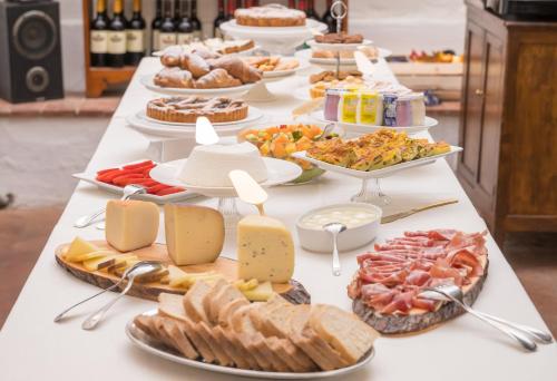 a table with many different types of food on it at Antica Fattoria La Parrina in Orbetello