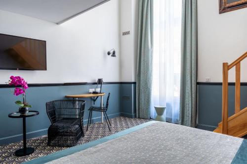 En eller flere senge i et værelse på Hotel Malte - Astotel