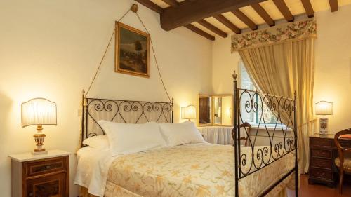 Säng eller sängar i ett rum på Antica Fattoria La Parrina