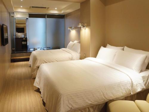 Tempat tidur dalam kamar di Hotel Relax I