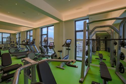 a gym with treadmills and elliptical machines at Self Check-in Hotel von Rotz in Wil