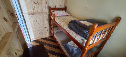 an overhead view of a bedroom with two bunk beds at Hostel Caxias do Sul in Caxias do Sul