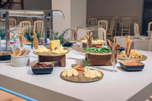 a table with many plates of food on it at Iberostar Waves Las Dalias All Inclusive in Adeje