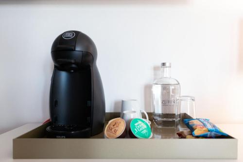a coffee maker sitting on top of a counter at Zurin Charm Hotel in Lisbon