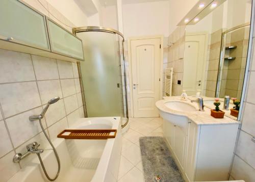 a bathroom with a sink and a shower and a toilet at Dimora Concept - Casa Leon - Bike room in Finale Ligure