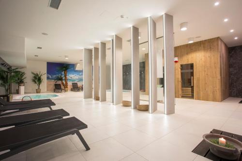 a living room with a pool and a building at Focus Hotel Premium Lublin Conference & SPA in Lublin