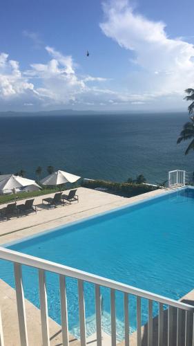 a swimming pool with a view of the ocean at Vista Mare Samana The Best View!! in Santa Bárbara de Samaná