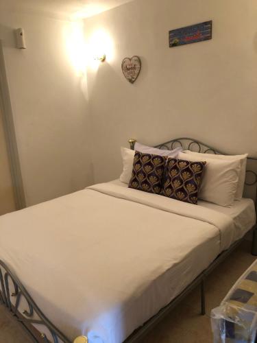 Säng eller sängar i ett rum på Berjaya Hills Sweet Homestay