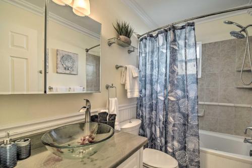 a bathroom with a sink and a toilet and a shower at 4 Mi to Beach Gem with Pool and Lanai in Seminole! in Seminole