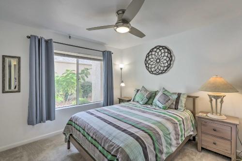 a bedroom with a bed and a window at 1 Mi to Old Town Scottsdale Condo with Pool Access in Scottsdale