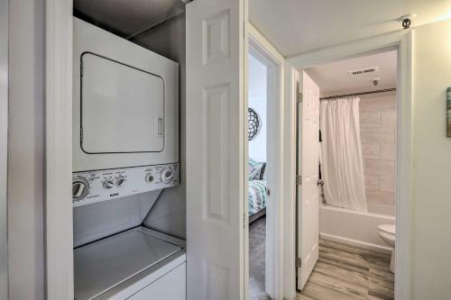 a bathroom with a television and a bathroom with a bed at 1 Mi to Old Town Scottsdale Condo with Pool Access in Scottsdale