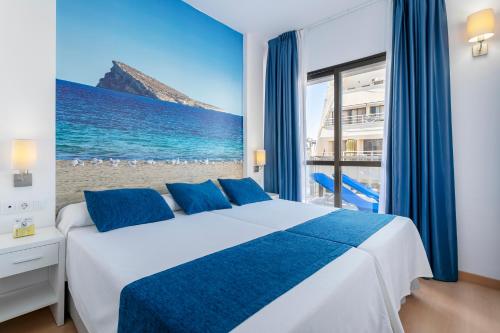 Postel nebo postele na pokoji v ubytování Hotel Avenida