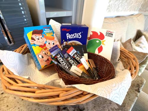 a basket filled with books and pens and books at Stunning Shepherds Hut with Superb Views & Fire Pit near a Superb Gastro Pub in Lamerton