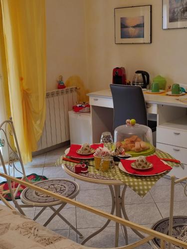 a kitchen with a table with food on it at B&B Lety in Alghero