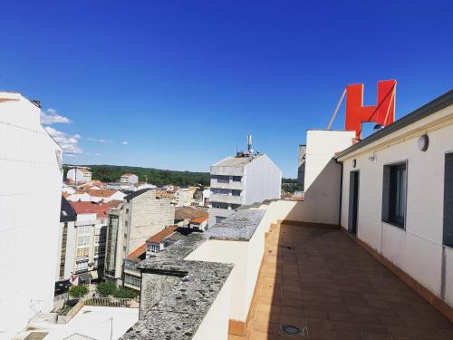 a view of the city from the roof of a building at Aparthotel Arenteiro in Carballino
