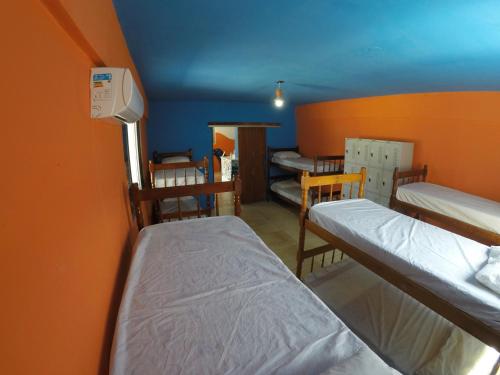 En eller flere senge i et værelse på Flor Da Ilha
