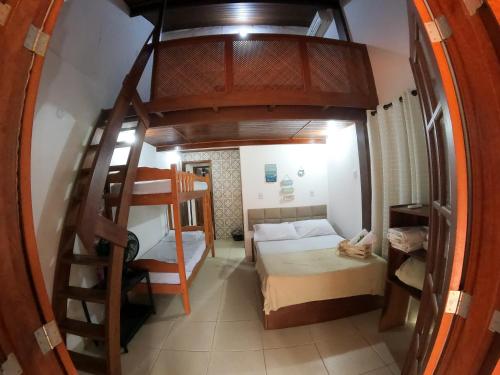 Ένα ή περισσότερα κρεβάτια σε δωμάτιο στο Casa de temporada S Lany