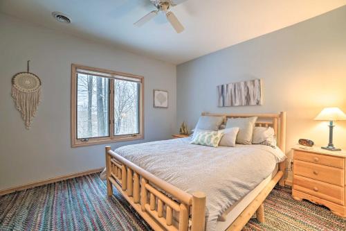 A bed or beds in a room at Resort-Style Harbor Springs Home with Deck!