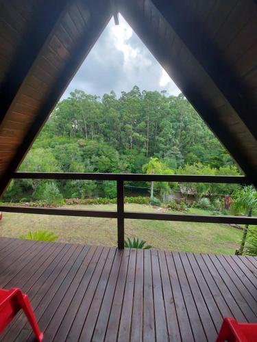 a view from the inside of a screened in porch at Pousada Esperança in Osório