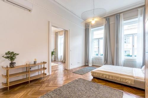 Posteľ alebo postele v izbe v ubytovaní Central Basilica Apartman